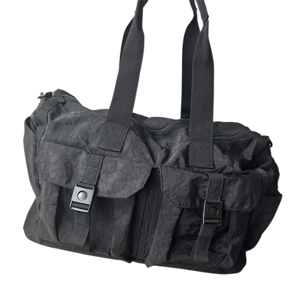 Tommy Bahama black travel duffle bag with hand and shoulder straps